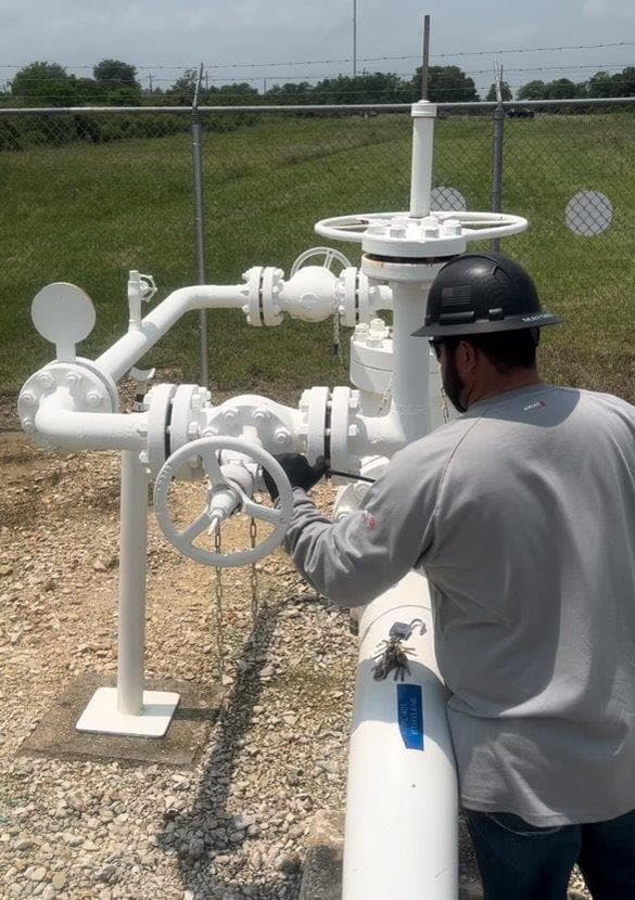 A man maintains one of Motiva's pipelines.